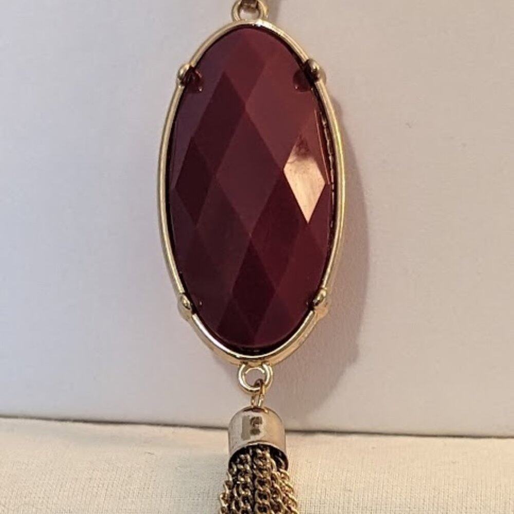 Long Gold Tone Red Reversible Pendant With Tassel